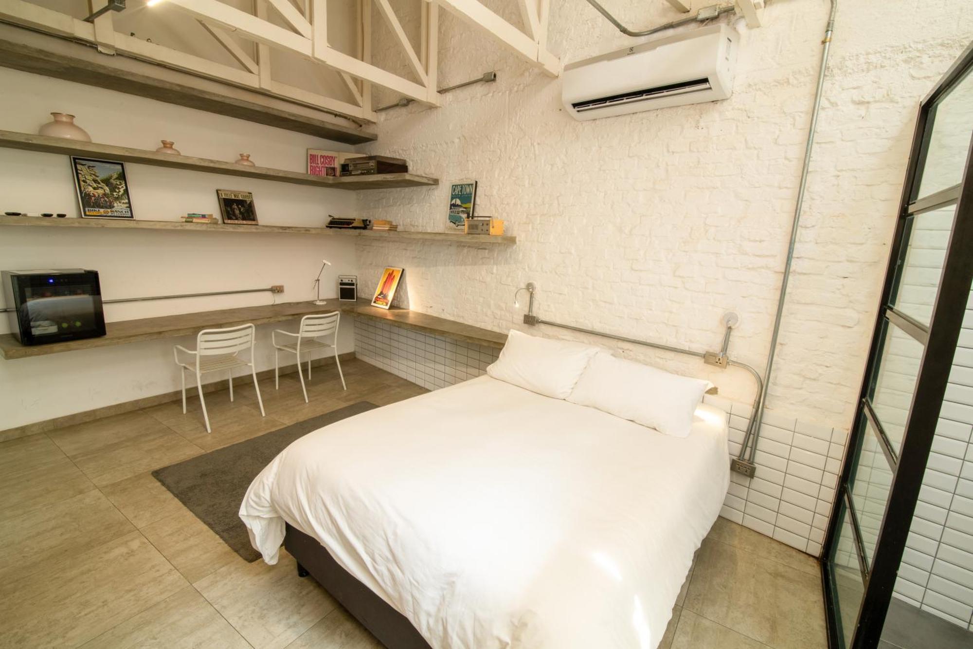Cosmopolitano Hotel Boutique Santa Cruz de La Sierra Exterior foto A bedroom in a micro apartment